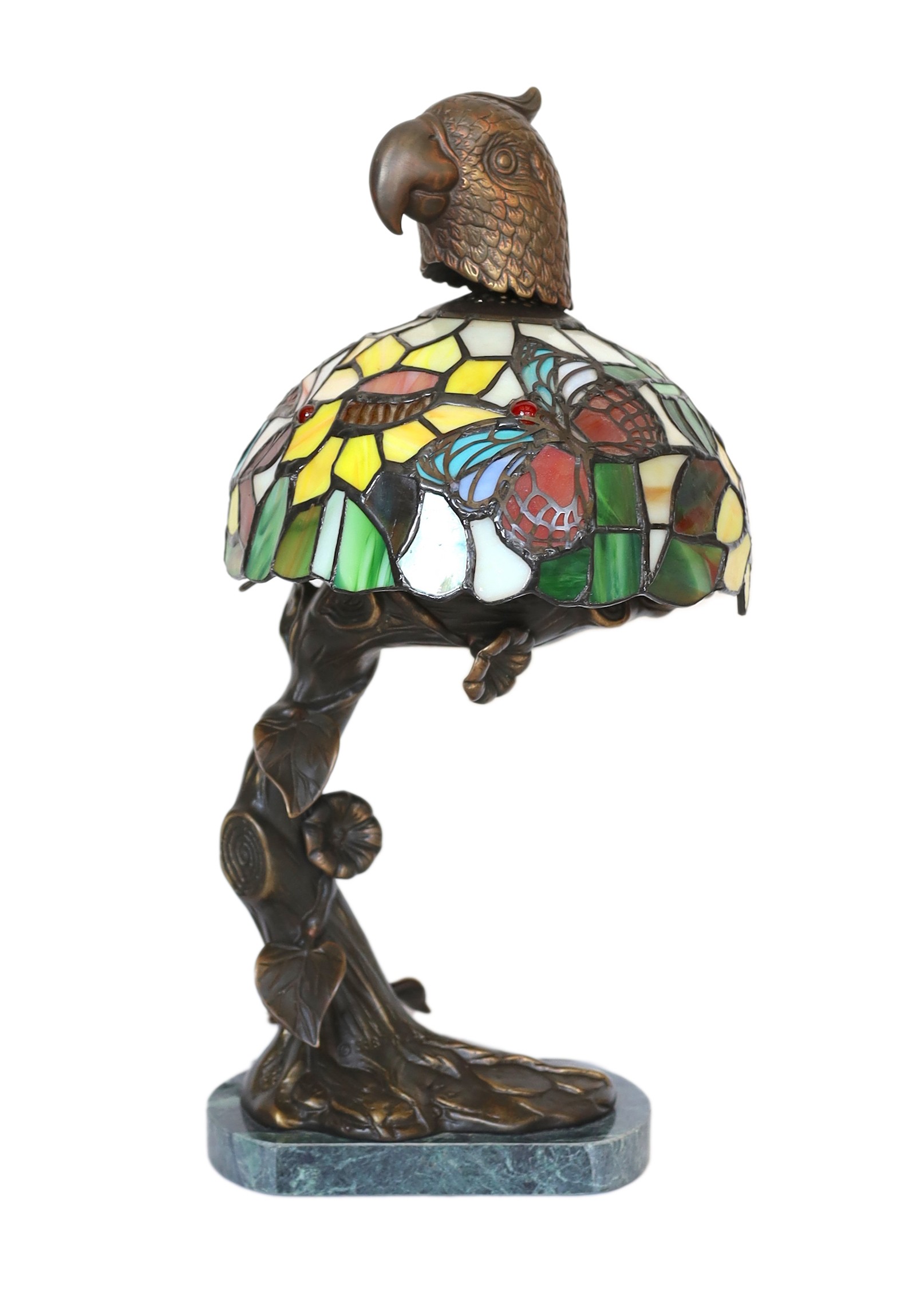 A bronze, stained glass and marble table lamp modelled as a flowering tree with parrot head, height 44cm